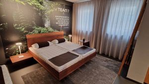 TEAM 7 riletto bed in walnut natural oil in the TEAM 7 showroom in Dortmund