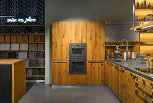 Loft kitchen in wild oak with stainless steel roller cabinet from TEAM 7 Frankfurt