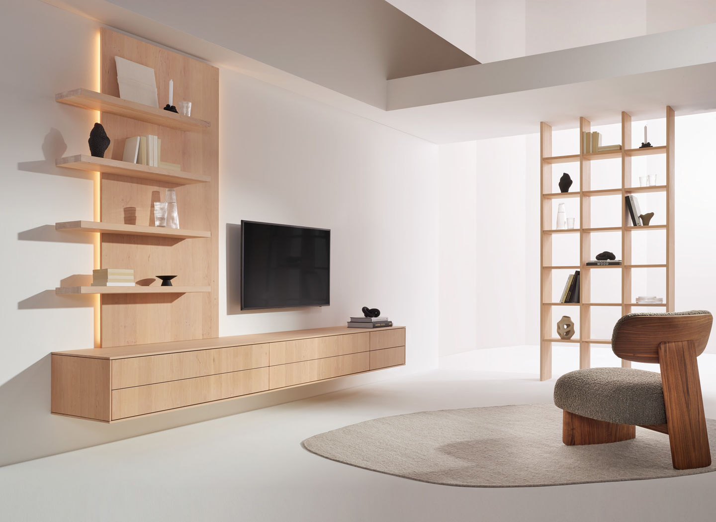 filigno wall unit in alder white oil and elliot lounge chair in walnut by TEAM 7