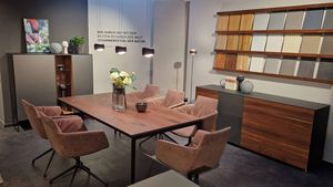 TEAM 7 tak table and cubus pure sideboard and highboard in walnut and grand lui chairs in the TEAM 7 showroom in Dortmund