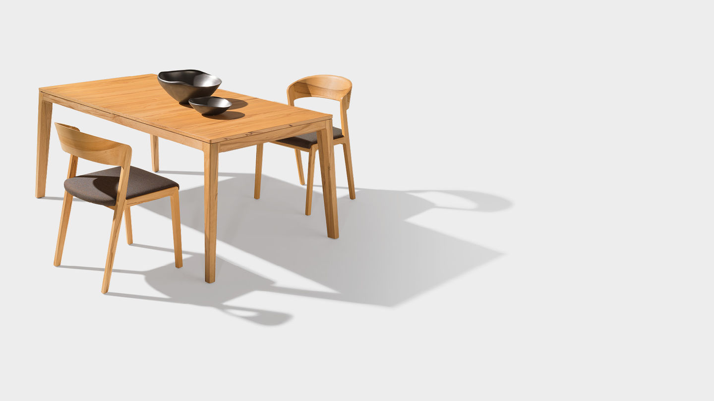 mylon table with upholstered mylon chair in beech heartwood